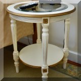 F37. Round painted side table. 26”h x 23”w 